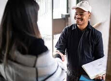 man shaking hands with a woman